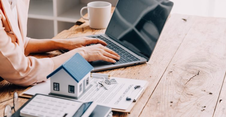 Real estate broker agent presenting and consult to customer to decision making sign insurance form agreement, buy and sell home model, concerning mortgage loan offer for and house insurance